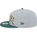 gorra-plana-gris-y-verde-snapback-9fifty-tip-off-2023-de-milwaukee-bucks-nba-de-new-era