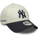 casquette-courbee-beige-et-bleue-marine-ajustable-9forty-side-script-new-york-yankees-mlb-new-era