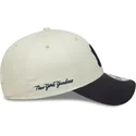 new-era-curved-brim-9forty-side-script-new-york-yankees-mlb-beige-and-navy-blue-adjustable-cap
